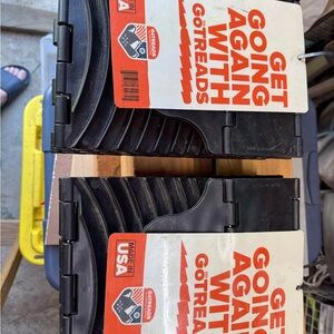 Black Traction Tool for car. Helps in snow, mud, sand